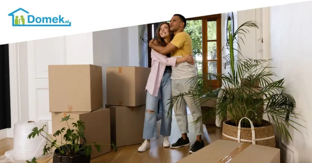 Couple moving into a new home in the Netherlands surrounded by moving boxes