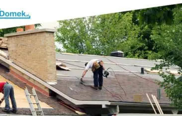 Workers replacing the roof of a typical Dutch house during a roof renovation project